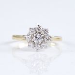 A mid/late 20th century unmarked high carat gold diamond cluster flowerhead ring, set with round