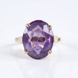 A late 20th century 18ct gold amethyst dress ring, set with large oval mixed-cut amethyst,