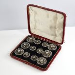 A set of 12 Georgian unmarked silver and colourless paste dress buttons, pierced sunburst design