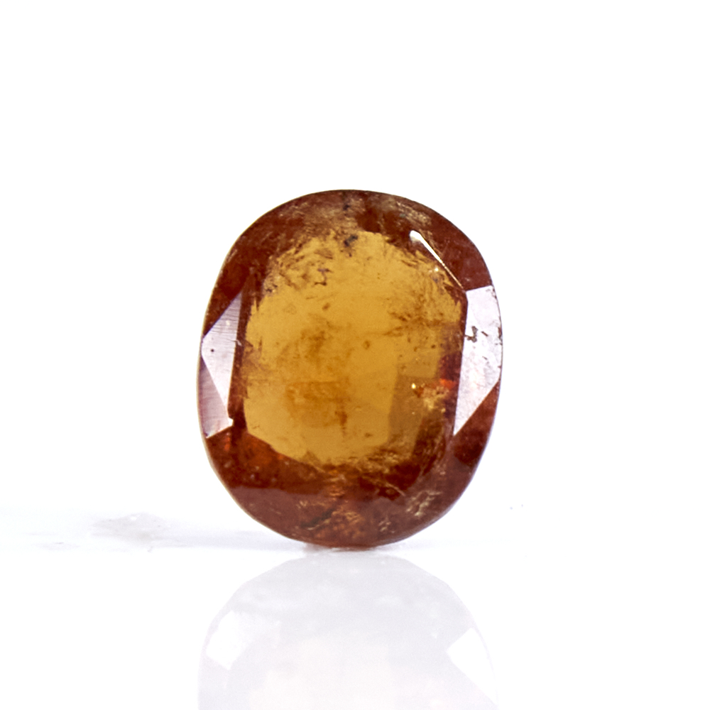 A 5.40ct unmounted oval mixed-cut hessonite garnet, dimensions: 13.00mm x 11.10mm x 6.00mm, 1.08g,