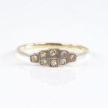 An Art Deco 18ct gold diamond panel ring, set with eight-cut diamonds with openwork bridge, total