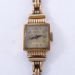 ALTAIR - a lady's Vintage 18ct gold mechanical wristwatch, silvered dial with gilt Arabic