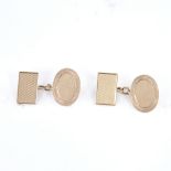 A pair of early 20th century 9ct gold cufflinks, oval and rectangular panels with engine turned