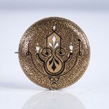 A Victorian unmarked high carat gold and enamel bombe brooch, textured settings with Adams style