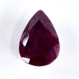 A 118.00ct unmounted pear-cut ruby, dimensions: 36.00mm x 26.00mm x 14.00mm, 23.85g, with GLI Report