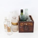 An Antique apothecary drawer, containing various jars and bottles, some with original painted and