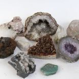A group of natural crystal geode shards and various gemstone specimens, including amethyst, rock