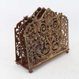 An early 20th century brass 2-section magazine/letter rack, pierced relief foliate decoration,