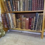 A shelf of large leather-bound books, including History of Sussex, Mr Bayle's Historical and