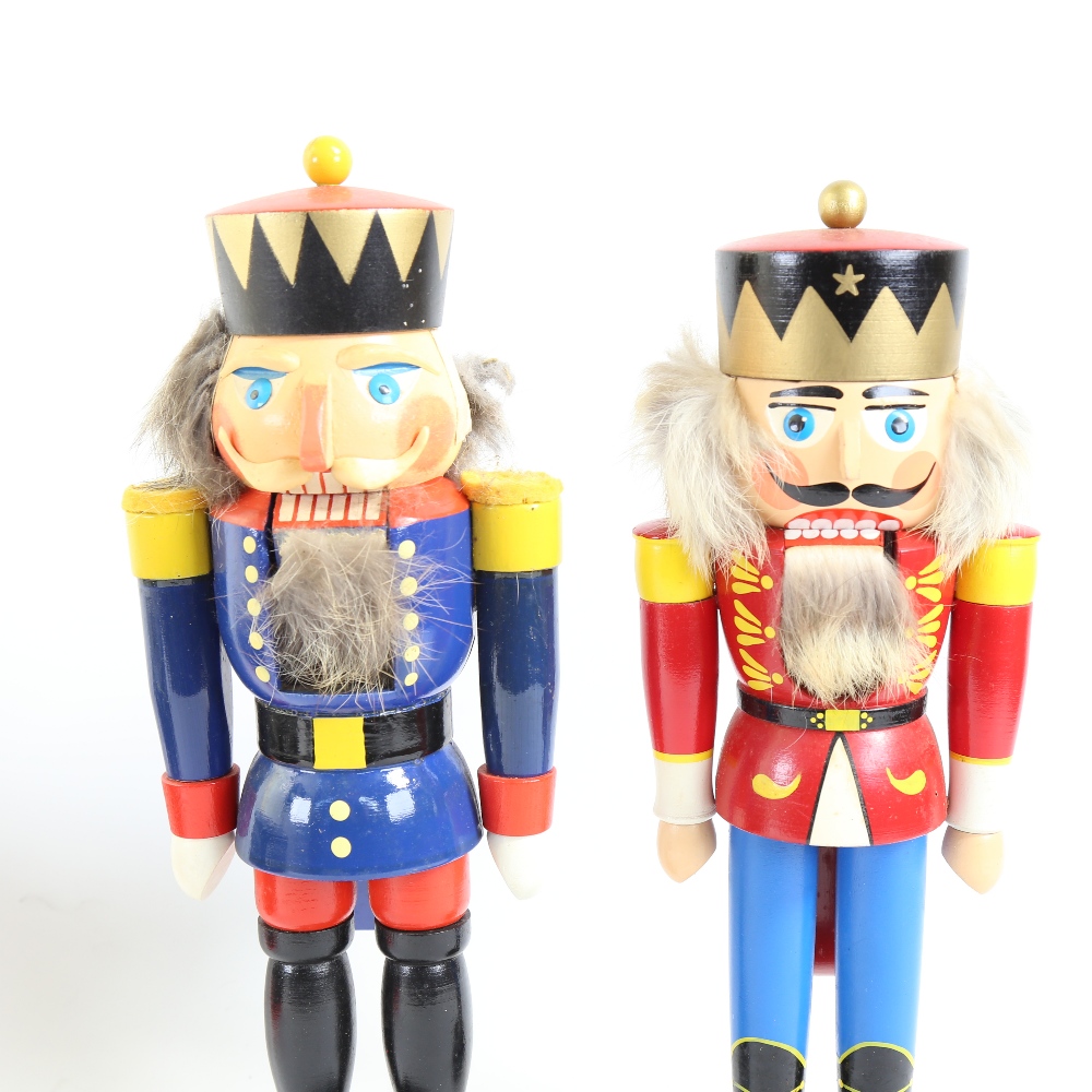 2 carved and painted wood nutcracker figures, largest height 34cm (2)