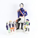 A group of 3 Staffordshire figures, including Louis, Napoleon, and Auld Lang Sygne, largest height