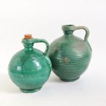 2 Continental green glaze pottery wine flagons, largest height 20cm (2)