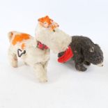 An early 20th century Alps mechanical clockwork playful puppy dog toy, and a similar Vintage Alps