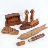 Various carved wood items, including 19th century oak needle case, Lucerne lion, elephant dragging a