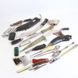 A box of various items, including clasp knives, Ronson table lighter, and kukri etc