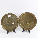 2 Middle Eastern brass plates, intricately engraved and embossed, largest diameter 24cm (2)