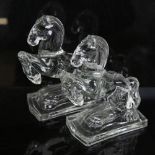 A pair of clear moulded glass rearing horse bookend figures, height 20cm