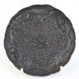 An early 20th century Japanese spelter dragon dish, relief embossed dragon pearl and chrysanthemum