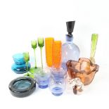 An engraved blue glass decanter and stopper, and 5 matching glasses, green glass candlesticks, and