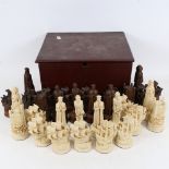 A full set of resin chessmen, figures in Elizabethan dress, Queen height 12.5cm, in storage box