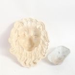 An 18th century Creamware lion mask jelly mould, length 25cm, and another smaller fleur-de-lis mould