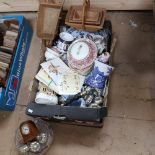 A boxful of various items, including magnifying glass, basket, miniature wheelbarrow etc