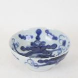 An 18th/19th century Chinese blue and white dragon bowl, mark on base, diameter 12cm