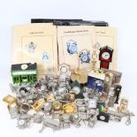 A boxful of miniature quartz clocks, binders etc