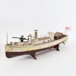 A handmade painted wooden-hulled steam gunship, hull length 44cm, on wood stand
