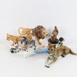 A group of porcelain animals, including Beswick lions, Szeiler zebras etc (some A/F)