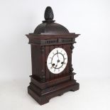 An oak-cased 8-day mantel clock by Junghans, with gong and pendulum, height 50cm