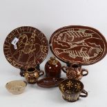 A group of slip glaze earthenware pottery, including Sussex money box, fish plate, jelly mould