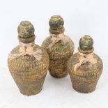 A graduated set of 3 Antiquity style oil jars and stoppers, largest height 19cm (3)