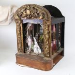 A 19th / early 20th century child's toy puppet theatre, with gilded surround, painted wood sliding