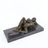 An erotic bronze sculpture on black marble base, length overall 22cm