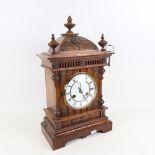 A Victorian oak-cased dome-top 8-day mantel clock, by Junghans, with brass embellishments