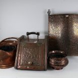 A copper-clad coal box, a copper coal bucket, embossed jardiniere and a fire screen