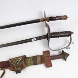 An Indian Damascene sword in scabbard, and 2 others