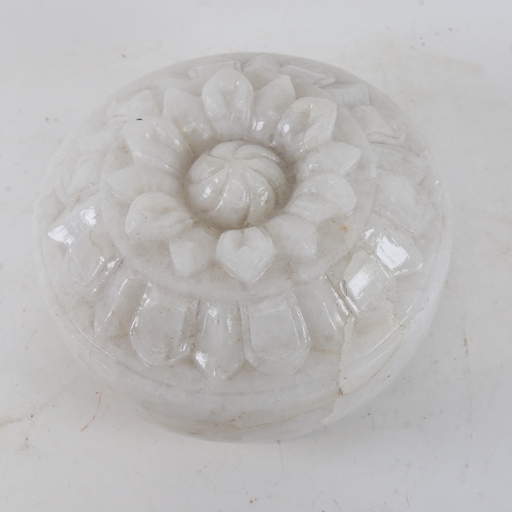 A heavy solid white marble/alabaster disc shaped carving, carved on both sides, diameter 25cm, cased