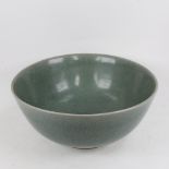 A Chinese celadon bowl on foot, 36.5cm diameter