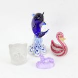 Various glass animals, including Venetian latticino duck, dolphin, and French lavender glass dog,