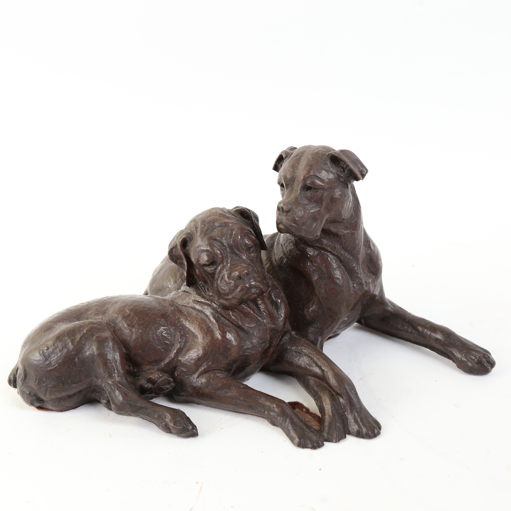 A resin seated Bullmastiff dog sculpture, unsigned, length 27cm, height 13cm (repaired front leg)