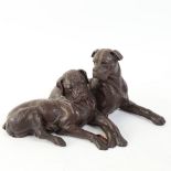 A resin seated Bullmastiff dog sculpture, unsigned, length 27cm, height 13cm (repaired front leg)