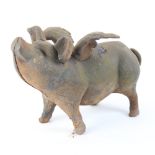 A heavy weathered black painted cast-iron figural flying pig money bank, length 32cm