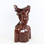 A wooden bust of an Eastern figure, height 40cm