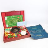 A Vintage cased casino set, including miniature roulette wheel, cards, chips, dice, Bridge set etc