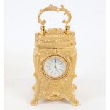 A modern gilt-brass cased miniature carriage clock, relief foliate decoration, with printed dial and