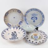 A group of Delft Ware and faience plates and bowls, largest diameter 24cm (5)
