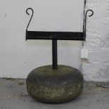 A Scottish curling stone converted to a boot scraper, H40cm