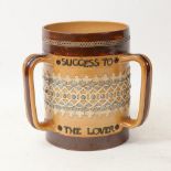 A Doulton Lambeth stoneware tyg, Success to the Lover, Freedom to the Slave, Honour to the Brave,